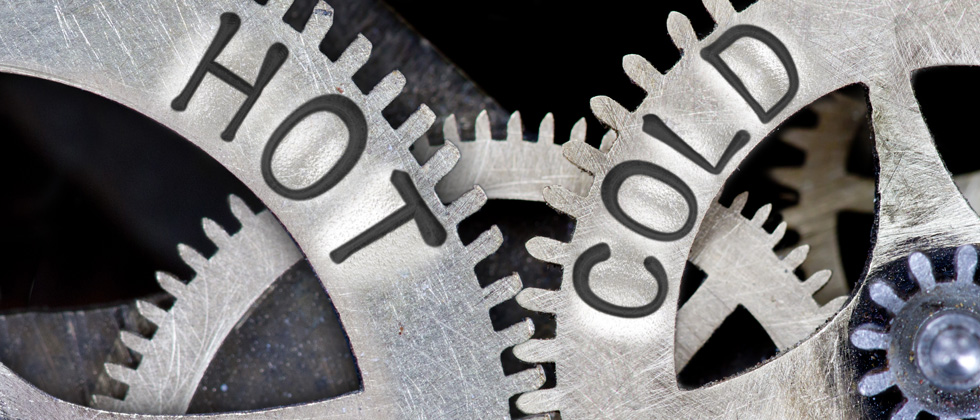 Two gears interlocking - one says HOT and ones says COLD