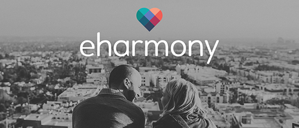 The colorful eharmony logo with a couple looking out onto the city