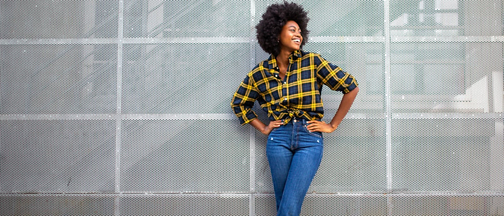 A confident fashionable woman posing and looking off to the side