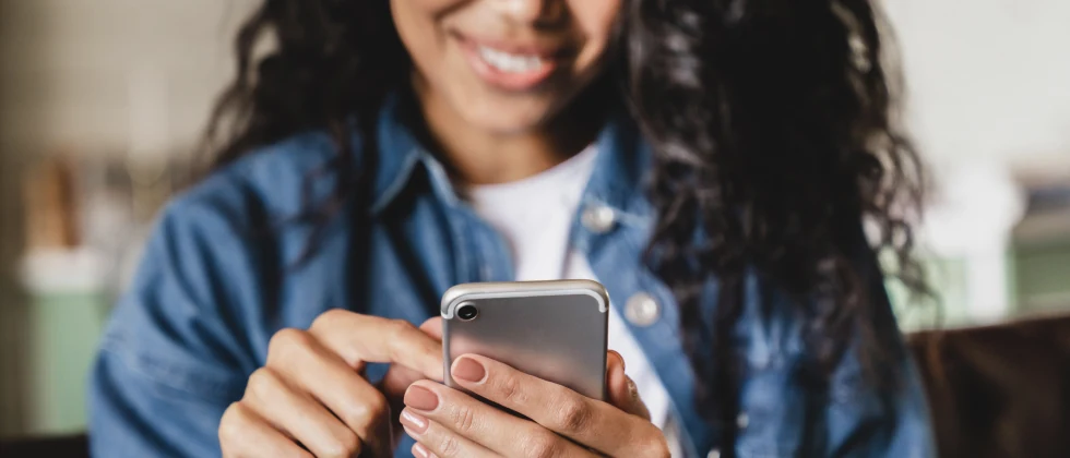A woman looking at her phone.