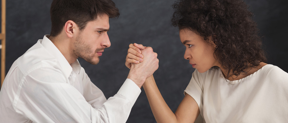 A couple looking like they're about to arm wrestle