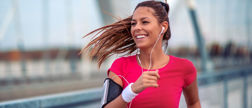 Young woman going for a nice run outside with music