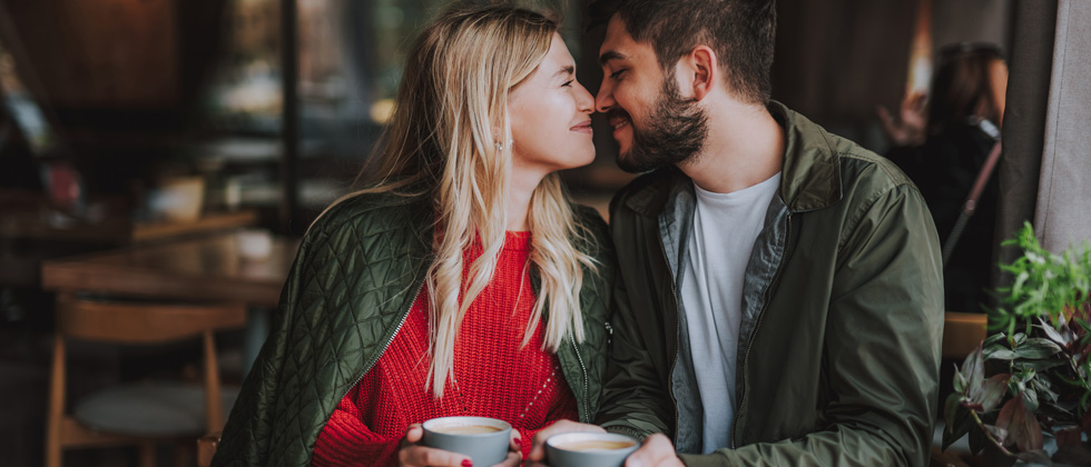 A couple looking lovingly at each other with their noses touching