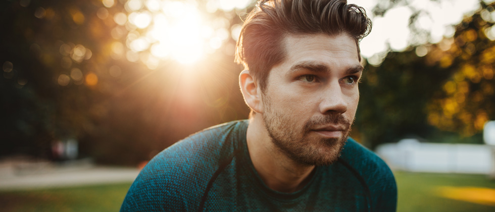 A man standing outside with an intense and serious look on his face