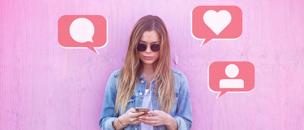 A woman with a message, heart & friend request popping out of her phone