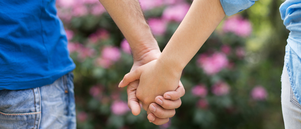 A couple on a walk holding hands