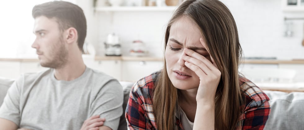 Couple having an argument with each other on the couch