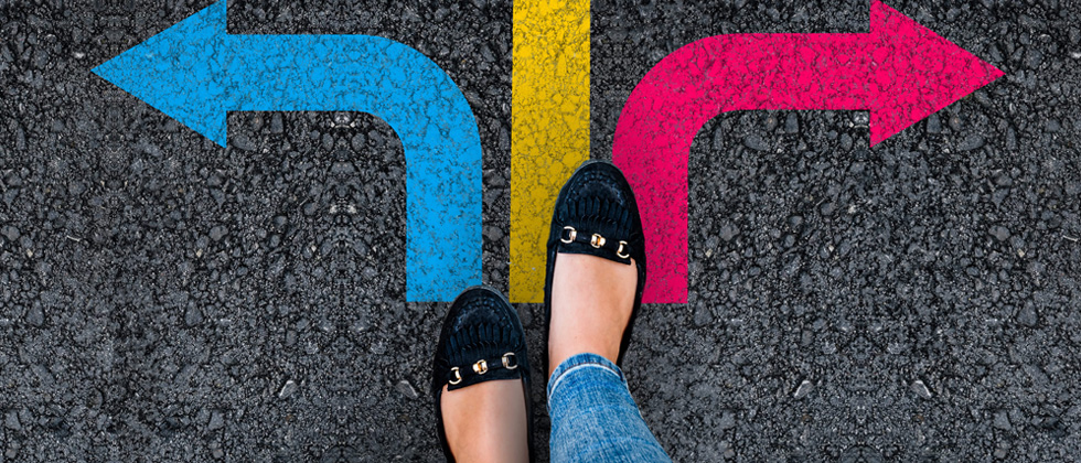 A woman at a crossroad with arrows pointing in 3 directions