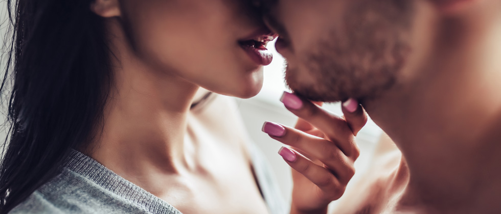 Couple about to share an intimate kiss