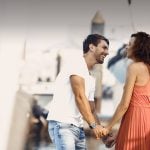 Arab dating symbolized by a man and woman holding hands and standing happily at the port in Canada