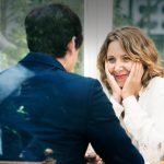 Christian dating symbolized by a man and a woman having a deep talk about their belief on a date in a canadian cafe