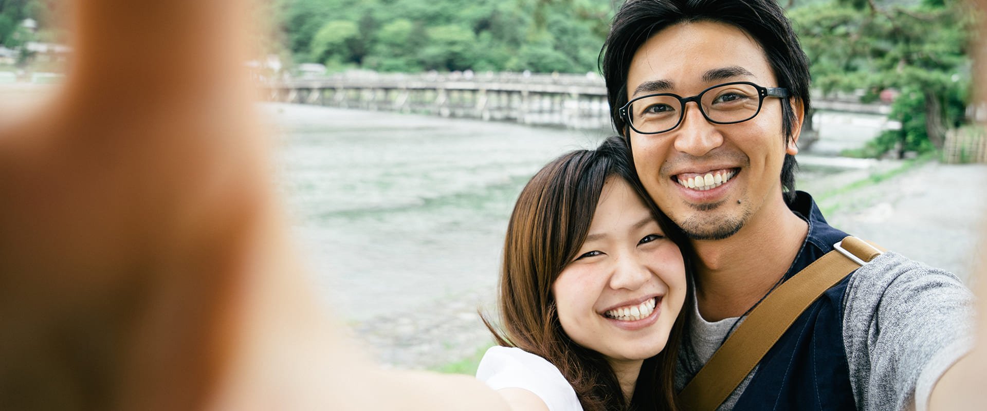 Japanese dating symbolized by a man and woman sitting cross-legged next to each other on a green field