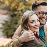 Professional dating symobolized by a couple sitting together and hugging each other