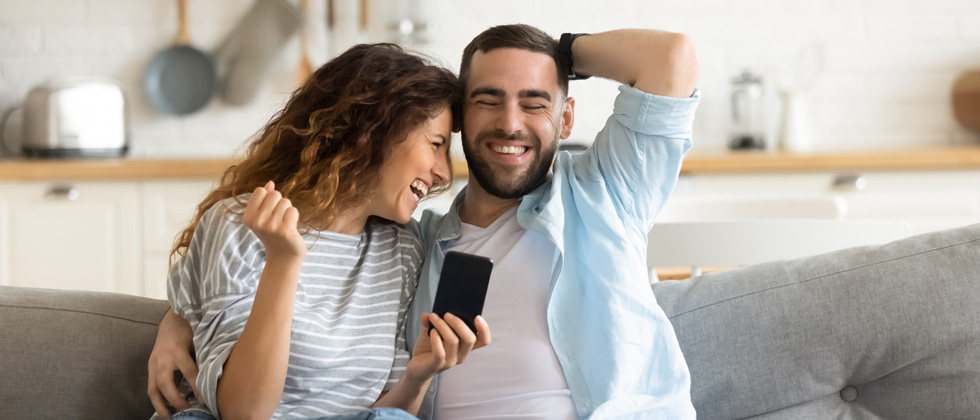 Is she the one symbolized by a happy couple sitting on the couch and having fun