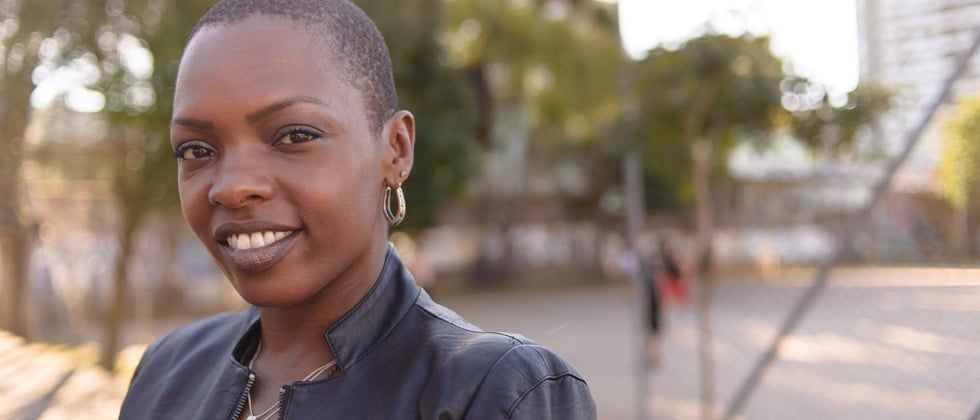 Strong smiling woman, making eye contact with the camera