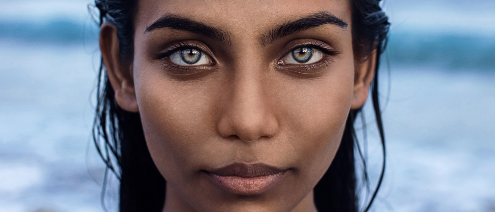 Young girl staring deeply into the camera with gorgeous big eyes