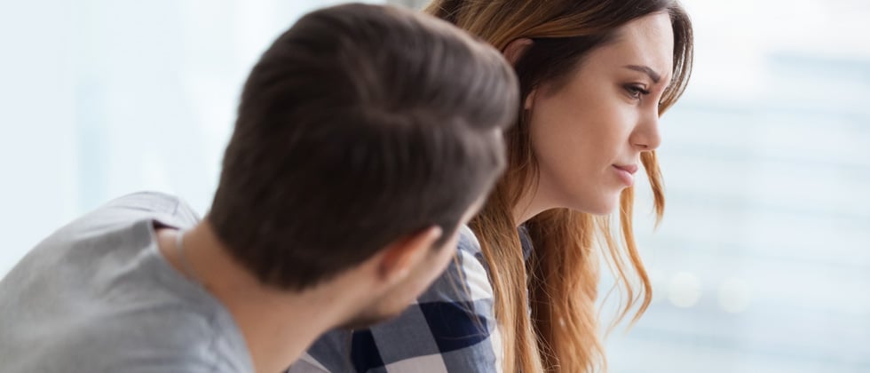 Couple having a deep and emotional talk & look upset