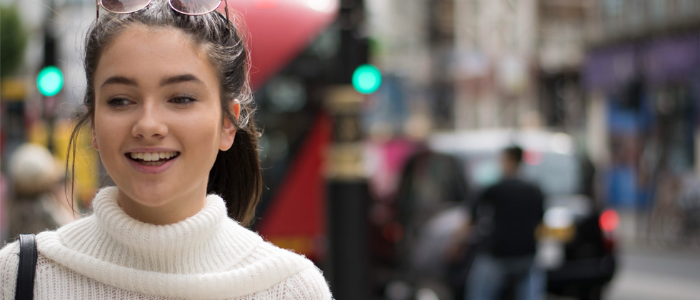 Optimize Online dating profile symbolized by a happy close up image of a smiling woman