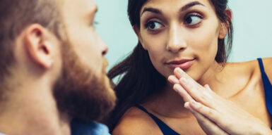 Woman looks man in the eye as an example of how to ask someone out