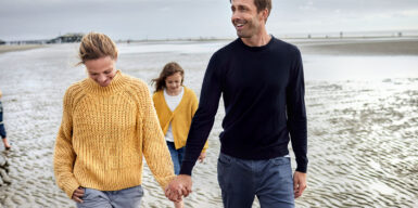 Man and woman with two children on beach as symbol for dating with kids