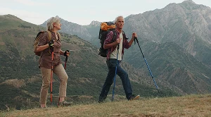 A couple hiking in the mountains.