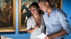 A couple browsing a museum together on a date.