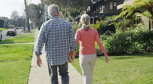 A couple walking hand in hand through historic streets. (Generated with AI) (Generated with AI)