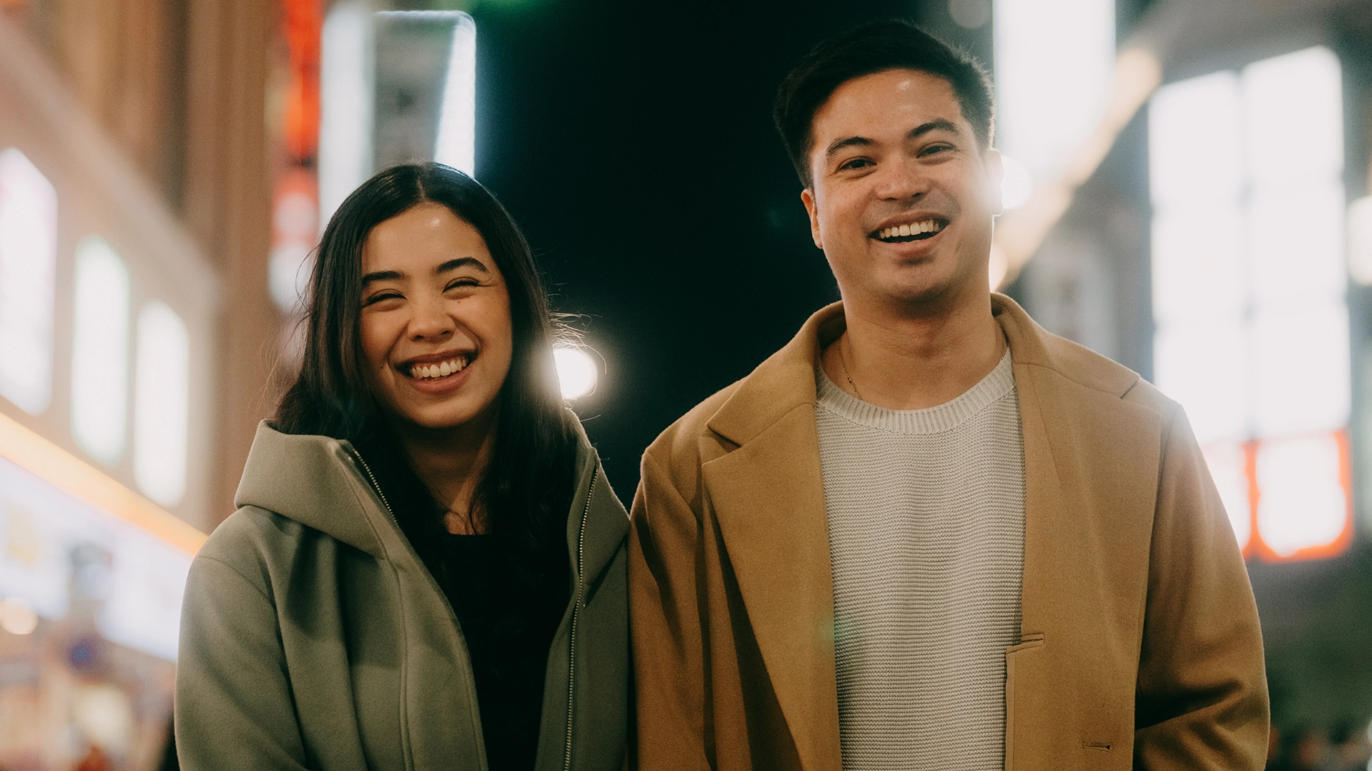 A Filipino couple strolling through the streets.